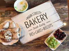 there is a sign that says main street bakery and other desserts on the table