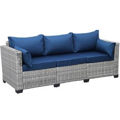 an outdoor sofa with blue cushions and pillows on it's back end, against a white background