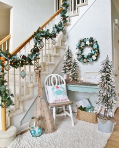 christmas decorations are displayed on the stairs in this home