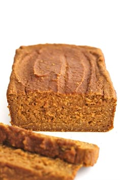 sliced loaf of pumpkin bread on a white surface