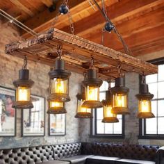 a restaurant with leather booths and chandeliers hanging from the ceiling above it is an old - fashioned light fixture