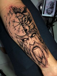 a man's arm with a tattoo on it and a clock in the middle