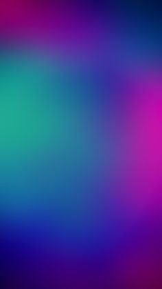 a blurry image of blue, pink and green colors