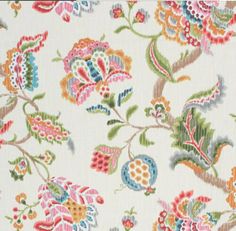 a white fabric with colorful flowers and leaves on it's side, as well as an image of a bird