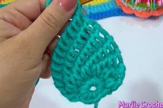 someone is crocheting an object with yarn