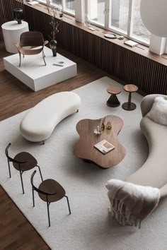 a living room filled with furniture next to a window