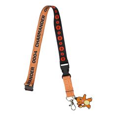 Never miss an adventure with this officially licensed Pokemon lanyard! Featuring a custom design complete with iconic graphics and characters, it's a must-have accessory for any Pokemon enthusiast. The attached rubbed charm showcasing the adorable Charmander adds a playful touch to your daily carry. Crafted from durable polyester and equipped with safety buckles, it ensures your essentials stay secure. For easy maintenance, simply wipe it clean with a damp cloth. Showcase your Pokemon fandom whi Pokemon Table, Pokemon Party Supplies, Junior Hoodies, Pokemon Faces, Kanto Region, Game Graphics, Pokemon Charmander, Pokemon Clothes, Pokemon Trainers