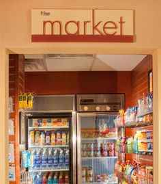 the market is stocked with all kinds of food and drinks, including milks, juices, and other beverages