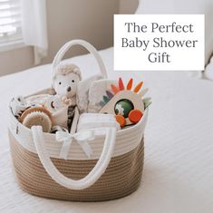 the perfect baby shower gift is in a basket with stuffed animals and toys inside it