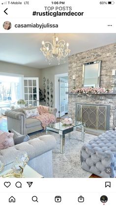 a living room filled with lots of furniture and a chandelier hanging from the ceiling