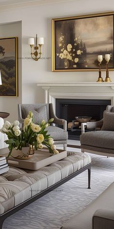 a living room filled with furniture and a fire place in front of a painting on the wall