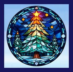 a stained glass window with a christmas tree in the center