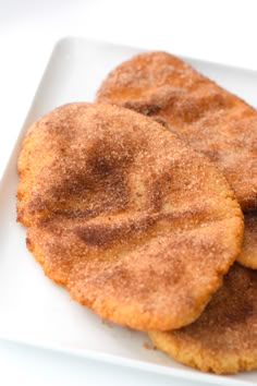 three fried food items on a white plate