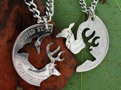 two necklaces with the words united states and deer on them, sitting next to each other