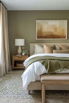 a bedroom with a bed, nightstands and paintings on the wall above it's headboard