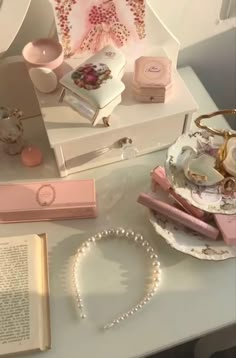 a table topped with lots of different types of jewelry