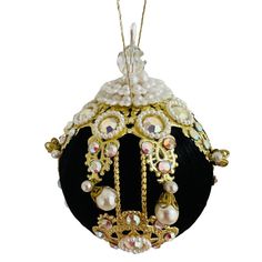 an ornament with pearls and beads on it