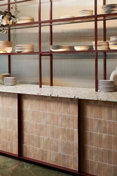 a counter with plates and bowls on it