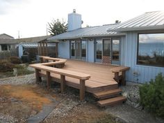 a large wooden deck in front of a house