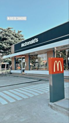 a mcdonald's restaurant is shown on the street corner