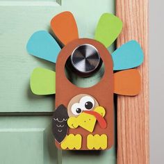 a door hanger with an owl and bird design on it's front door