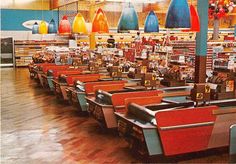 the interior of a grocery store with lots of chairs