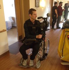 a man sitting on top of a bike in a room