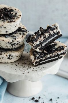 three cookies and oreo ice cream sandwiches stacked on top of each other