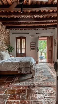 a bed sitting in a bedroom on top of a tiled floor next to a doorway