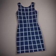 Clasaic St. John Windowpane Sleeveless Shift Dress In Navy Blue & White. Knee Length, Sleeveless, Windowpane Pattern, Scoop Neck, Back Zipper Closure. 69% Wool, 31% Rayon. Nwot Wrap Sweater Dress, Mock Neck Sweater Dress, Silk Shirt Dress, Purple Midi Dress, Jersey Knit Dress, Black Knit Dress, Midi Sheath Dress, Sleeveless Shift Dress, Midi Short Sleeve Dress