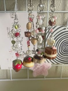 a bunch of food hanging from a hook on a tile wall next to a sign