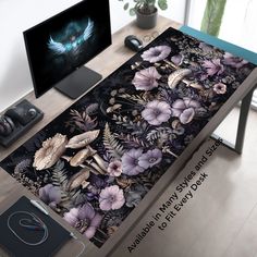 a computer desk with flowers and birds on it