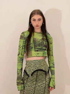 𝔇𝔢𝔱𝔞𝔦𝔩𝔰: Style: Fairy Grunge, Streetwear, Y2K Material: Spandex (Stretchable) This mesh top features a graffiti pattern and split sleeves, which can be your inspiration for making a grunge fairy look. With its stretchy fabric, this top can perfectly fit your body. Get free shipping with a purchase of over 80 $ at our store Model wears s with 5'5, 110 lbs SIZE LENGTH BUST SLEEVES 27 in 26-35 in 15 inM 28 in 28-36 in 16 inL 28 in 30-38 in 16 inItem measured by hands may have 1-2 in differences.... Fairy Grunge Tops For Spring Party, Fairycore Tops For Spring Party, Spring Fairy Grunge Party Tops, Spring Fairycore Party Tops, Spring Party Fairycore Tops, Fairy Grunge Long Sleeve Party Top, Fairy Grunge Long Sleeve Top For Party, Fitted Green Mesh Top, Fitted Fairy Grunge Green Top