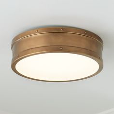 a round light fixture in an empty room