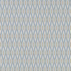 a blue and beige fabric with small circles on it