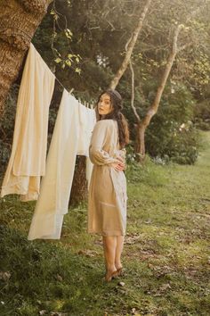 Model is faced away with face turned over her shoulder towards the camera. Model has both arms crossed behind her back and stands on tip toe. Clothes Line Photoshoot, Clothesline Photoshoot, Posing Photography, Ig Model, Shot Ideas, Little House On The Prairie, Creative Soul, House Clothes, Laundry Day