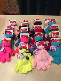 several pairs of gloves sitting on top of a table