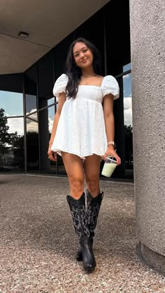 Outfit link: https://liketk.it/3KhKs  Cowboy boots, western boots, cowgirl, puff sleeve, romper, lwd, western chic, Princess Polly outfit, goodnight macaroon, black boots, concert outfit, festival outfit, meir, ameirylife Boots Concert Outfit, Black Western Boots Outfit, Black Cowgirl Boots Outfit, Cowgirl Boots Outfit Summer, Cowboy Boots Outfit Fall, Cowboy Boots Outfit Summer, Stampede Outfit, Tall Black Boots Outfit, Princess Polly Romper