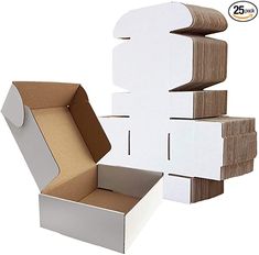 an open box and several cardboard boxes stacked on top of each other