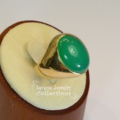 A beautiful simple Chrysoprase cabochon is the centerpiece of this 14k gold ring. It is rare to find chrysoprase in such fine green and even color tone! Ring Size: 9.5 Total Weight: 11.5 grams Precious Metal: 14k Yellow Gold Precious stones: -Chrysoprase Center Stone: 12.2 carats, 18.6mm x 13.3mm Hallmark: 14k Fine Jewelry Emerald Green Oval Cabochon Ring, Green Oval Cabochon Emerald Ring, Heirloom Green Emerald Oval Cabochon Ring, Heirloom Green Oval Cabochon Emerald Ring, Formal Green Cabochon Rings, Green Opal Oval Ring In 14k Gold, Classic Green Oval Opal Ring, Heirloom Style Green Emerald Ring With Polished Finish, Heirloom Style Polished Emerald Ring