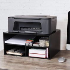 an office desk with a printer and computer on it