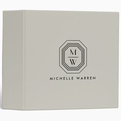 a white binder with the words, michael warnen in black lettering on it