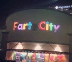 a store front with cars parked in front of it and the word fair city on the side