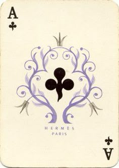 the back side of a playing card with an image of a stylized design on it