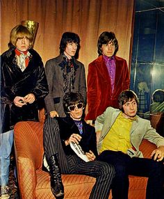 the rolling stones posing for a photo in their living room