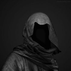 a person wearing a hooded jacket in the dark with their hood pulled back and his eyes closed