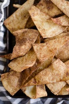 some kind of fried potato wedges on a black and white checkered table cloth