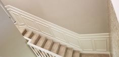 a stair case in a house with carpet on the floor