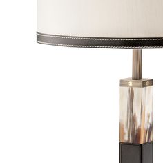 a table lamp with a white and black shade