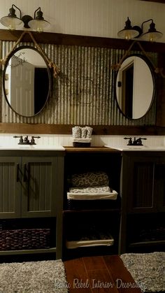 a bathroom with two sinks and mirrors above the sink, along with baskets on the floor